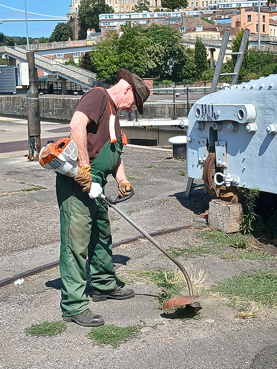 Chris helping us comply with our license condition to keep the area around the Bridge tidy